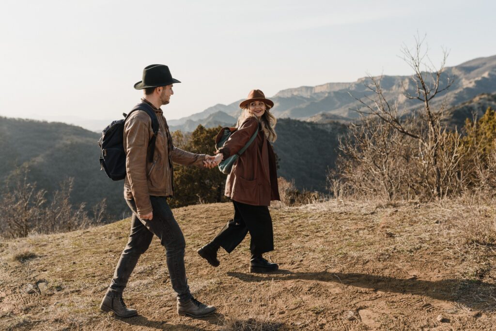 Loving couple goes for hike in the mountains