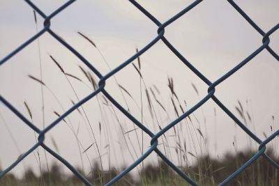 a chain linked fence representing the concept of setting boundaries in your personal life