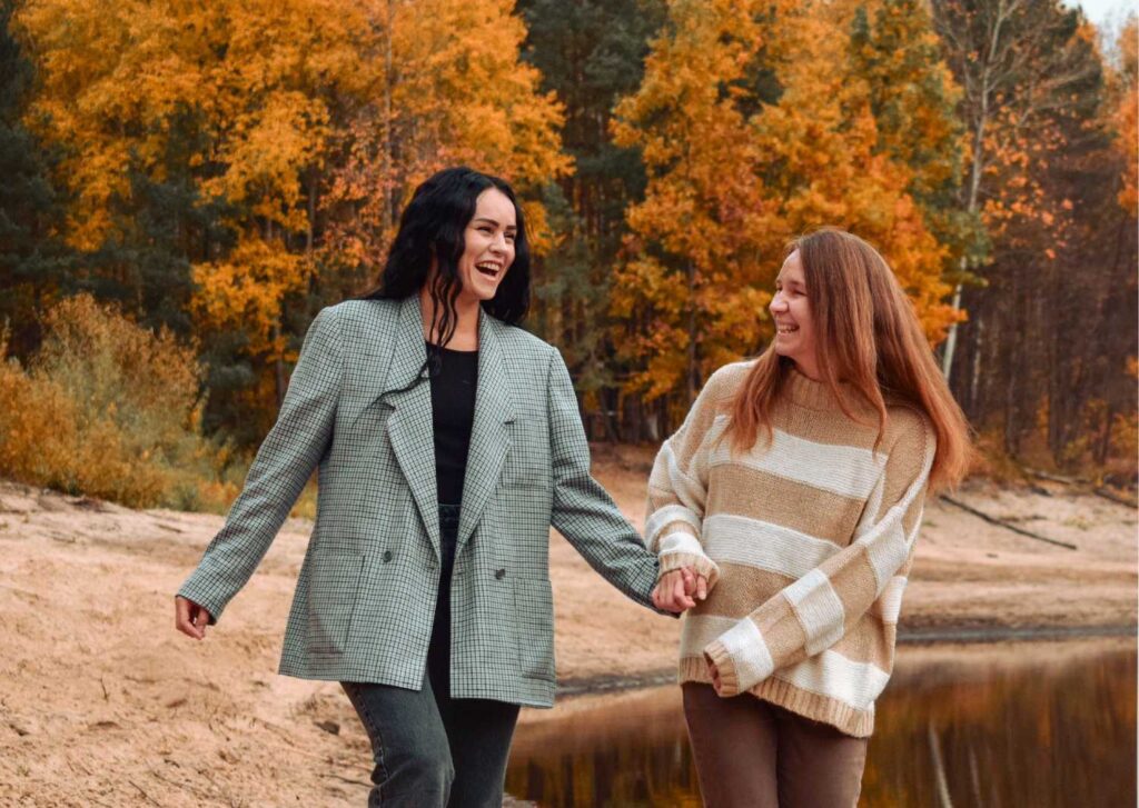 two friends walking together in the park supporting one another after a breakup in toronto